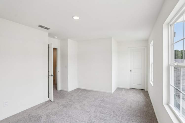 A hallway with white doors.