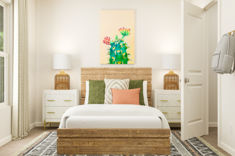 A bed with a white bed spread.