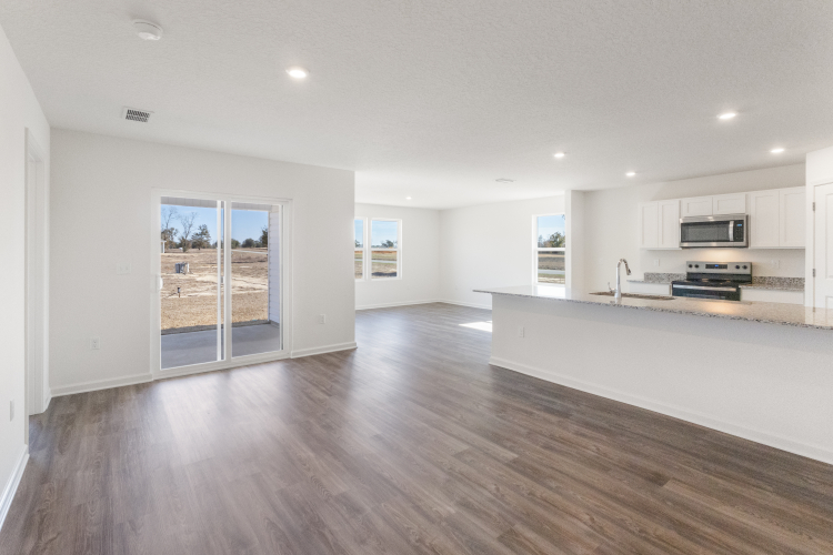 A large kitchen with white cabinets.