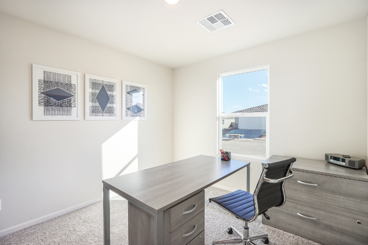 An office with a desk and a chair.