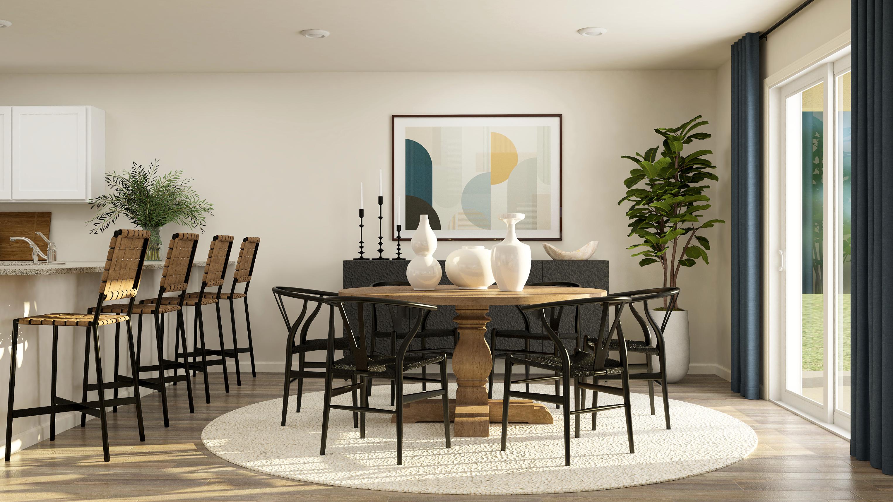 A dining room table with chairs.
