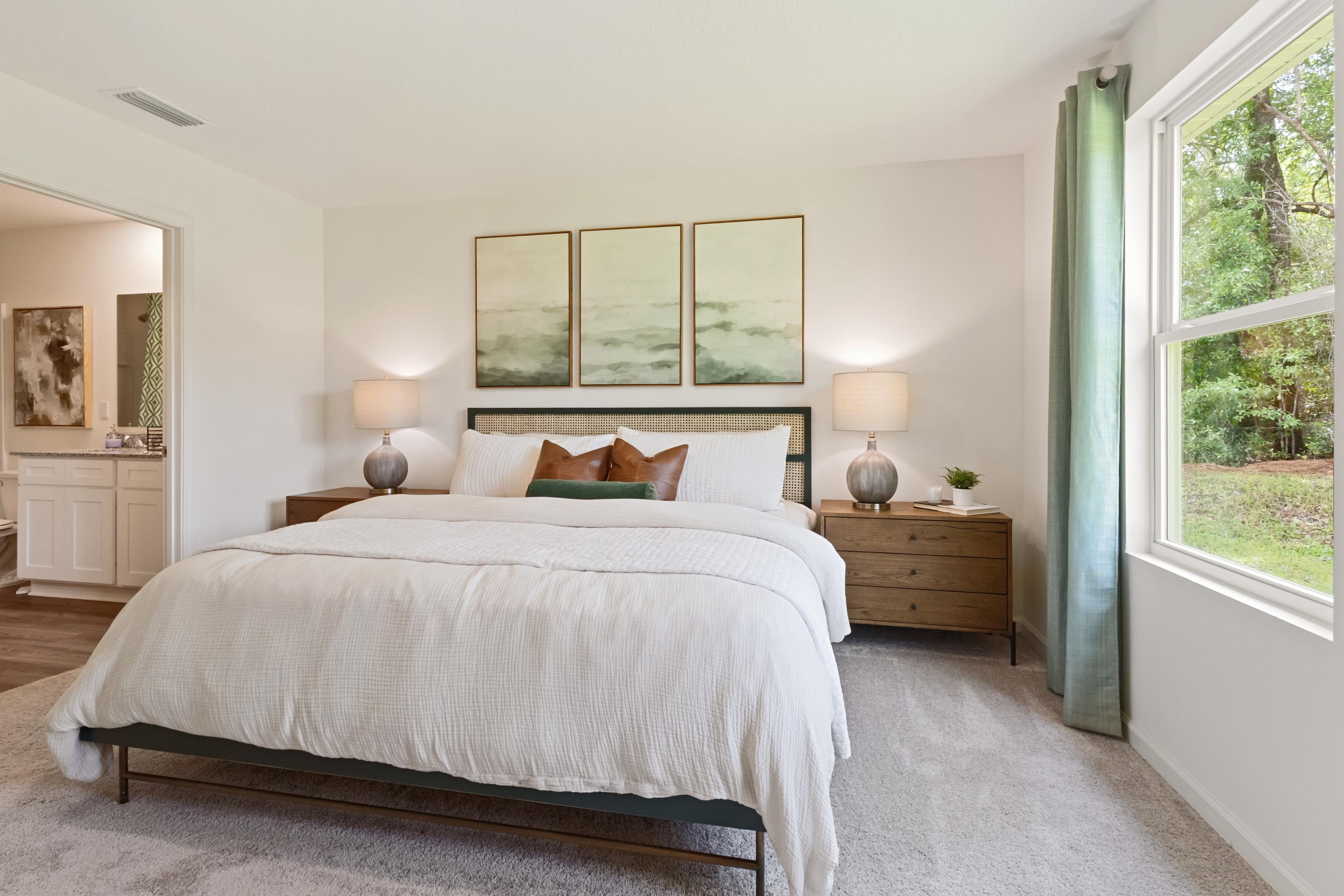 A bedroom with a large bed.