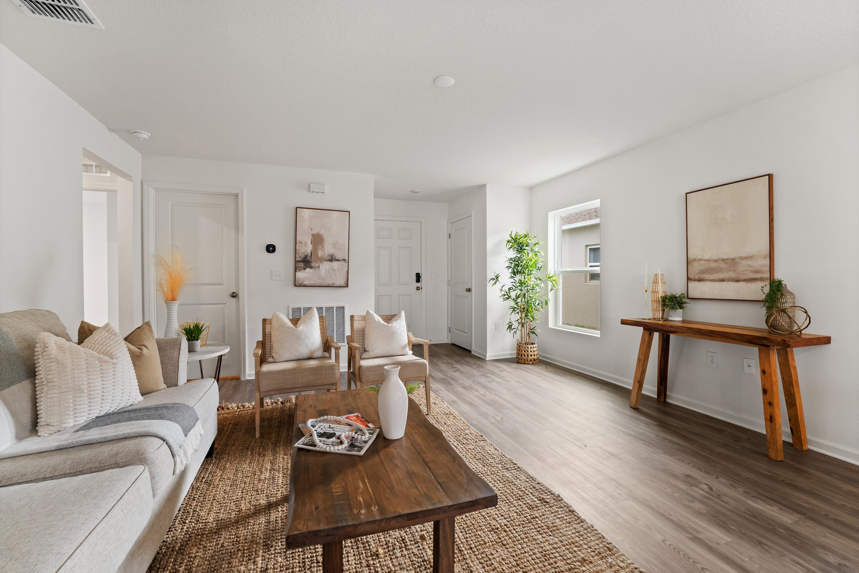 A living room with a wood floor.