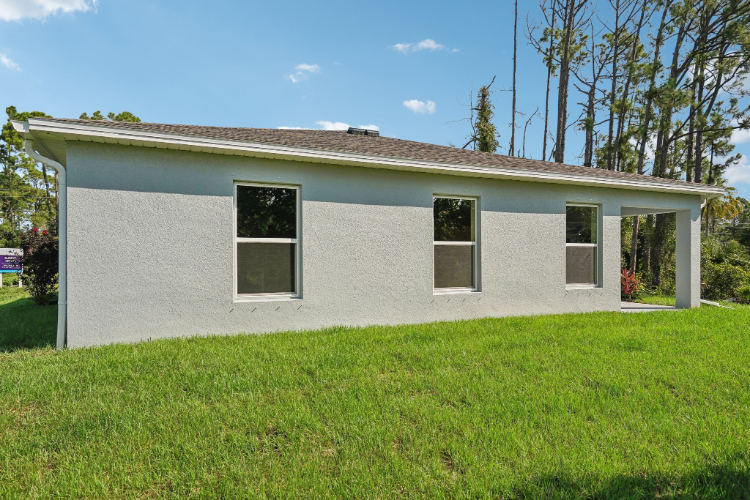 A house with a grass yard.