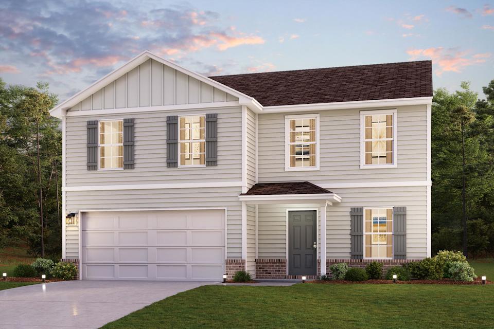 A white house with a garage.